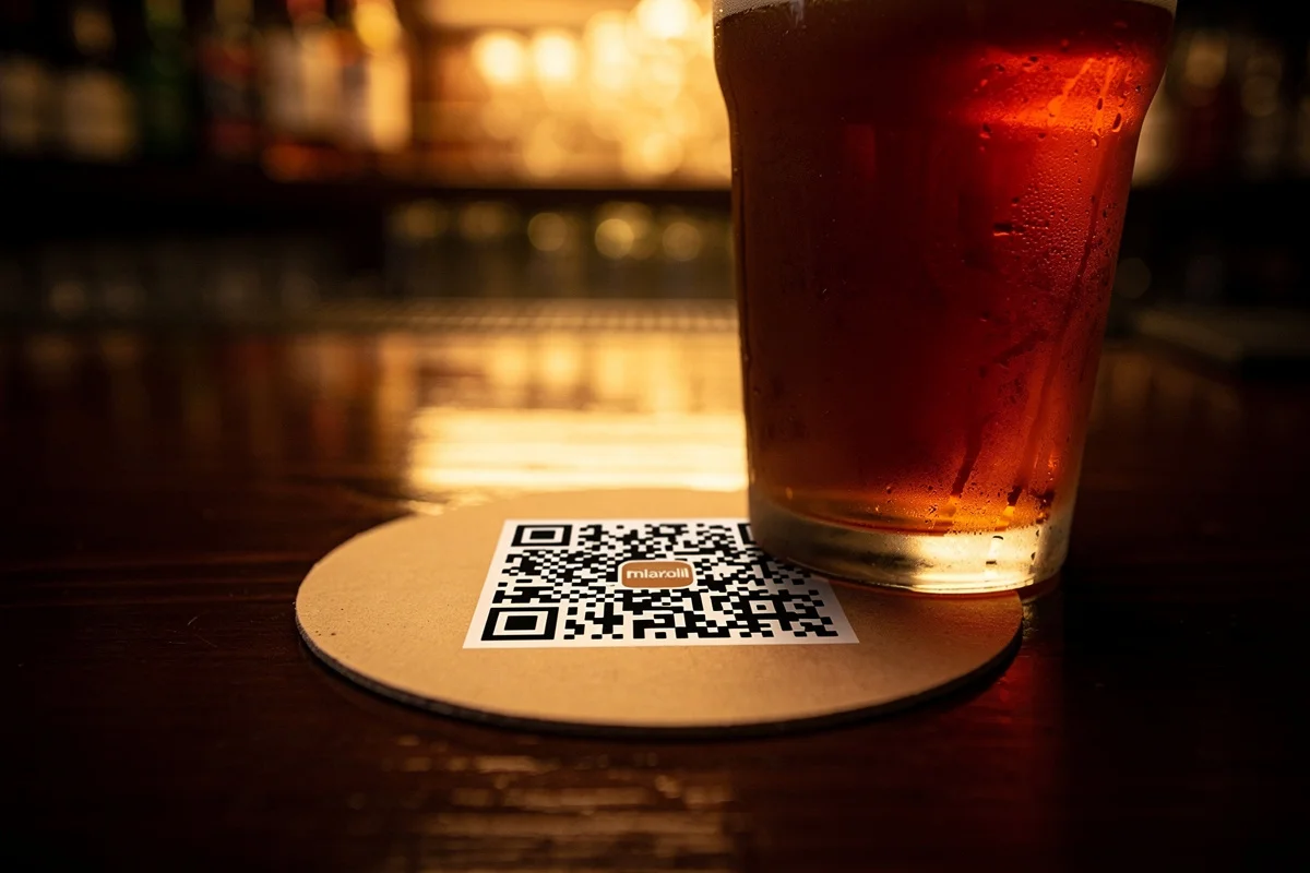 QR code on coaster at bar counter
